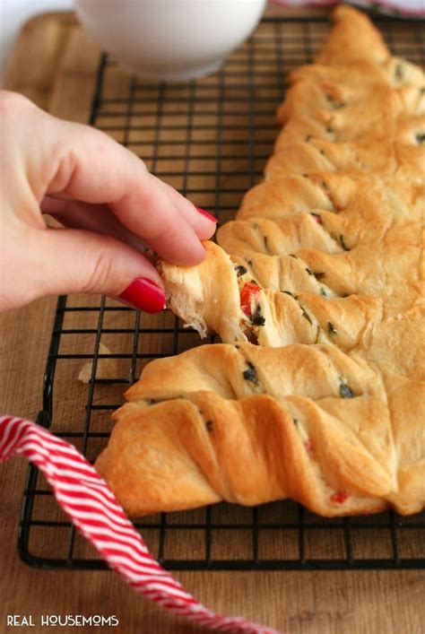 The combination of spinach and cheese is a classic and often combined with feta and phyllo dough. Spinach Dip Stuffed Crescent Roll Christmas Tree ⋆ Real Housemoms