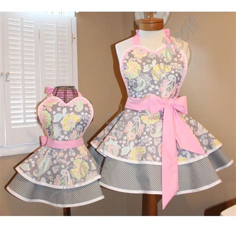mommy and me paisley print retro aprons accented in sweet pink now available in sizes 3t plus size