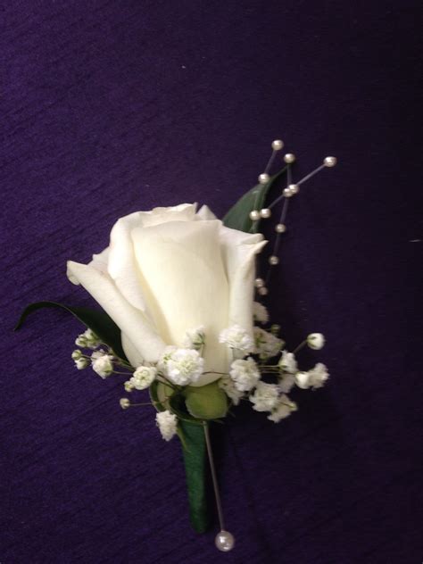 White Rose Boutonnière With Ruscus Babys Breath And Pearl Strands