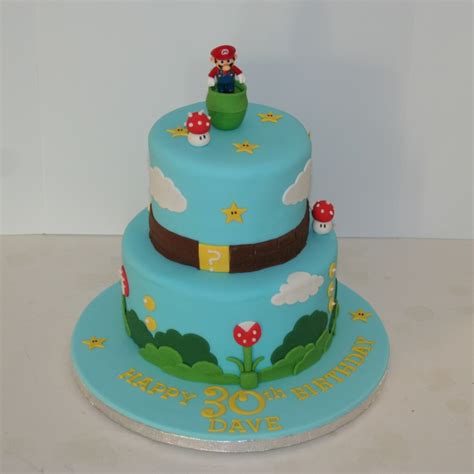 My brother's birthday is coming up so i'm thinking of making a wii, cookie, green cake for him. Two tier Super Mario cake