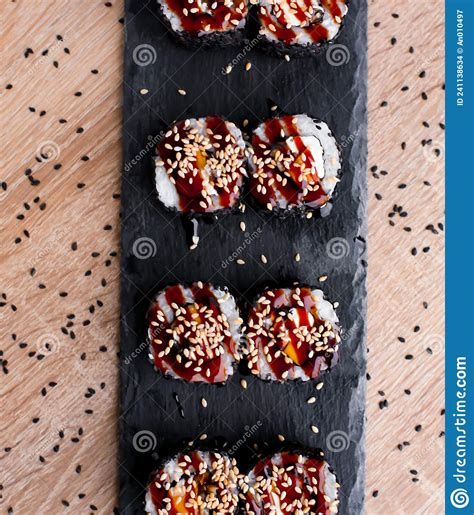 Sushi Set Nigiri And Sushi Rolls On Black Stone Slate Plate Board Stock
