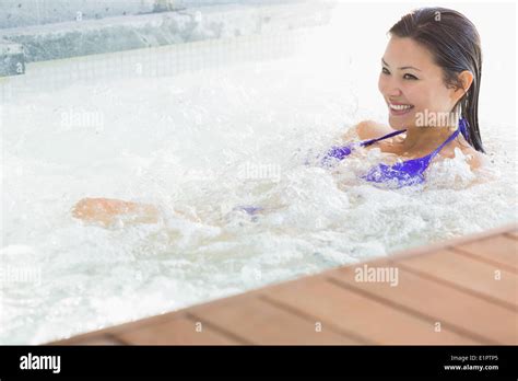 Smiling Brunette In Bikini Relaxing In Hot Tub Stock Photo Alamy