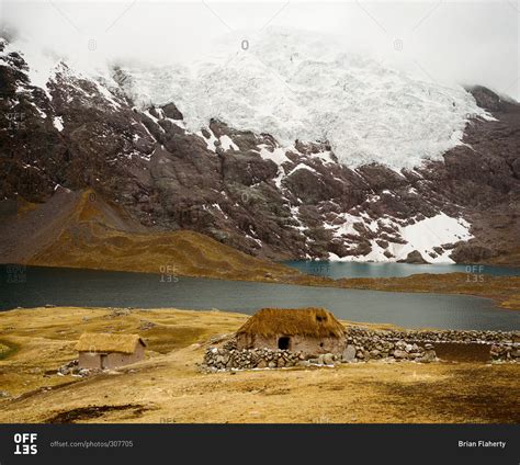 Earthen Hut And Glacier At Ausangate In The Andes Mountains Of Peru