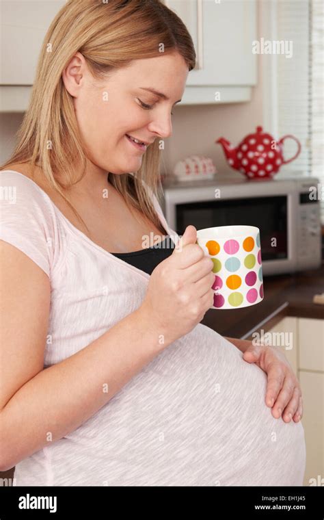 Pregnant Woman Relaxing With Hot Drink Stock Photo Alamy