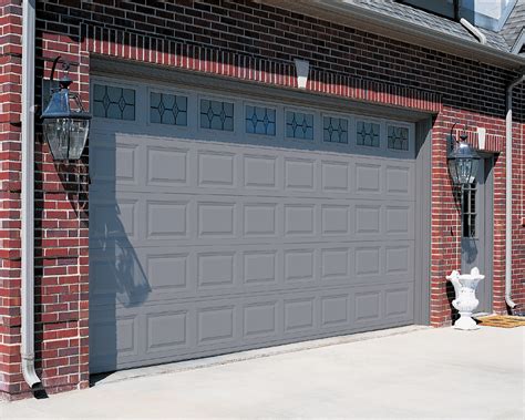 Creative door sells and installs beautiful black garage doors to scores of satisfied customers. Garage Doors | Springville Door & Window, Inc.
