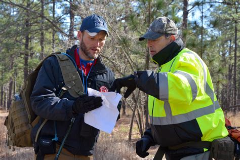 Search And Rescue Teams Practice Man Tracking Tactics During Mock