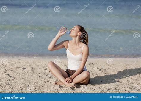 Woman Drinking Water From A Bottle On The Beach Portrait Stock Image Image Of Liquid Sand