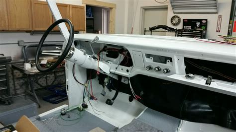 The Inside Of A Car With Its Dash Board And Steering Wheel In It S Center