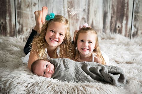 Newborn Photography Newborn Sibling Pose Sisters Excited For Baby