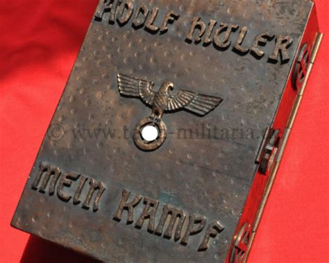 Well known book described as an autobiographical manifesto outlining the political ideology of hitler. Mein kampf metal box very impressive but...real??