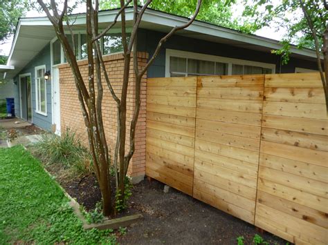 A wood fence costs $12 to $27 per linear foot for installation. basic, low cost horizontal fence | Outdoor Spaces ...