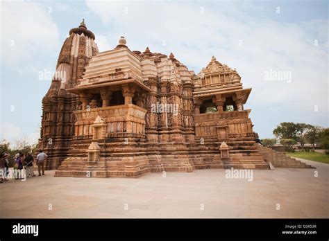 Tourists Admiring The Architecture Of A Temple Lakshmana Temple