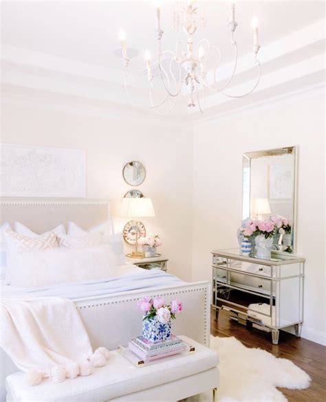 A bright feminine bedroom with a cnaopy bed, a wooden bench and a woven chair, a a cool modern feminine bedroom with apink geometric wall, a terracotta bed, white nightstands, color block. 20 Feminine Master Bedrooms (With images) | Grey bedroom ...
