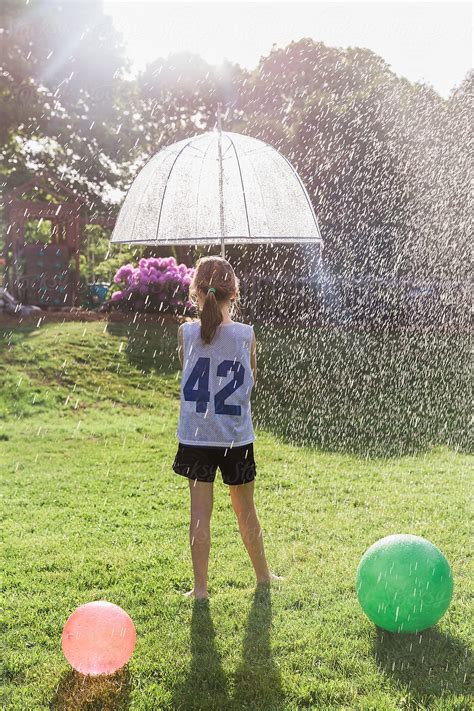 Summer Fun In Backyard By Stocksy Contributor Raymond Forbes Llc