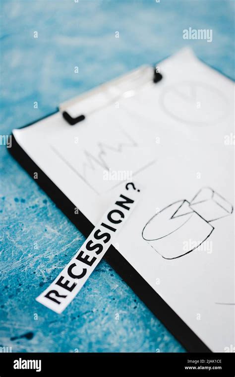 Recession And Stagnating Economy Conceptual Image With Text Next To