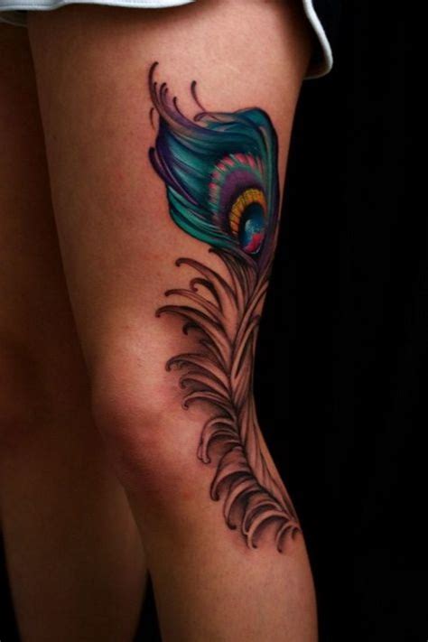 Great Lush Colorful Peacock Feather Tattoo On Hip Tattooimagesbiz