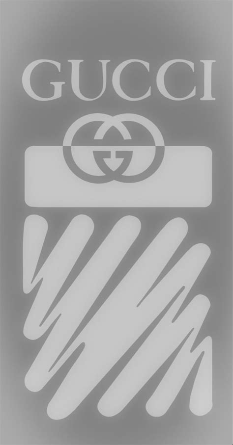 The Gucci Logo Is Shown On A Gray And Black Background With White