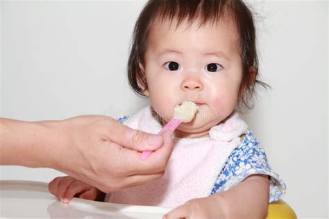 Japanese Baby Girl Eating Baby Food Stock Photo Image Of Person