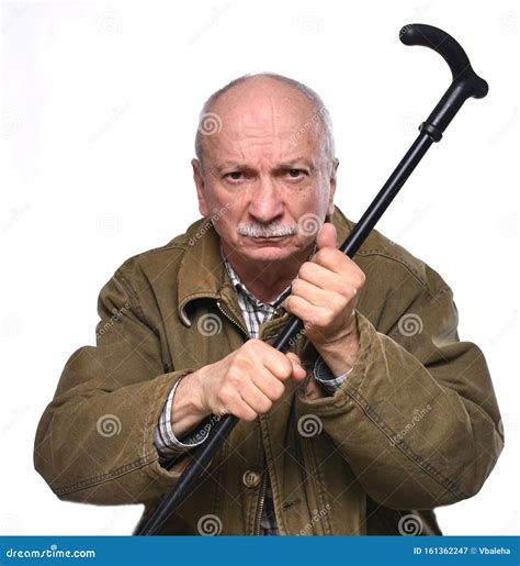 Old Angry Man Threatening with a Cane in Studio Stock Image - Image of