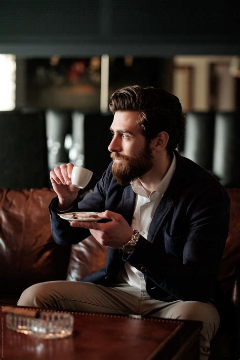 Handsome Bearded Man Drinking Coffee By Stocksy Contributor Brkati