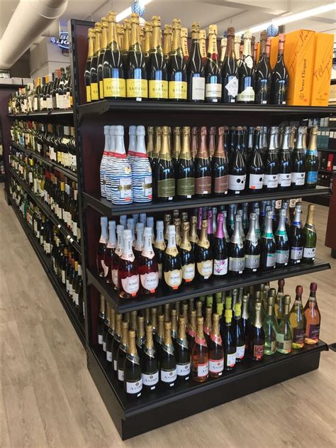The Shelves Are Filled With Many Different Types Of Wine And Liquor