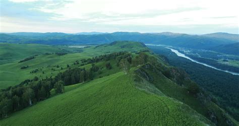Aerial View Flight Over A Green Grassy Rocky Hills Altai Mountains
