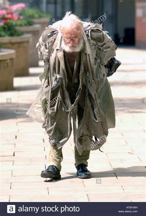 Tramp Homeless Man Walking The Streets In Edinburgh Scotland Stock