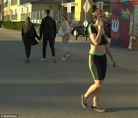Model Walks Down Beach In Spray On Workout Clothes Daily Mail Online