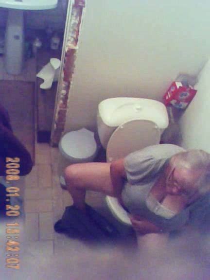 Horny Granny Gets Caught On Tape By Me When Peeing In The Toilet Room