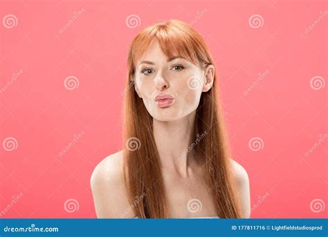 Redhead Girl Posing With Kissing Face Expression Isolated On Pink Stock