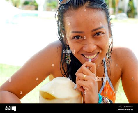 lifestyle natural portrait of 30s or 40s happy and attractive asian indonesian woman in bikini