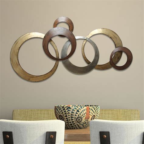 If you're looking for an excuse to treat yo' self—or your space—to something fresh, consider it found. Stratton Home Decor Metallic Rings Wall Decor-SPC 999 ...