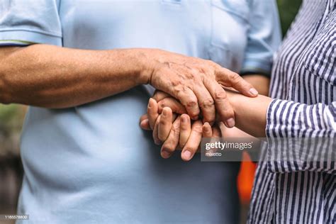 Senior Couple Holding Hands High Res Stock Photo Getty Images
