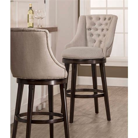 You'll find chairs upholstered in smooth velvet and crisp linen in a myriad of hues, and even medallion and floral prints. Halbrooke Upholstered Swivel Bar Stool in Smoke by ...