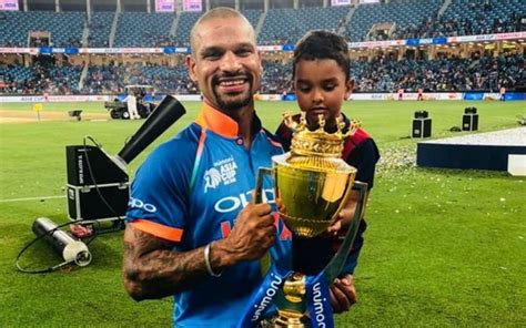 Shikhar dhawan dancing with his son and wife during quarantine. Shikhar Dhawan proudly lifts the Asia Cup trophy with son ...