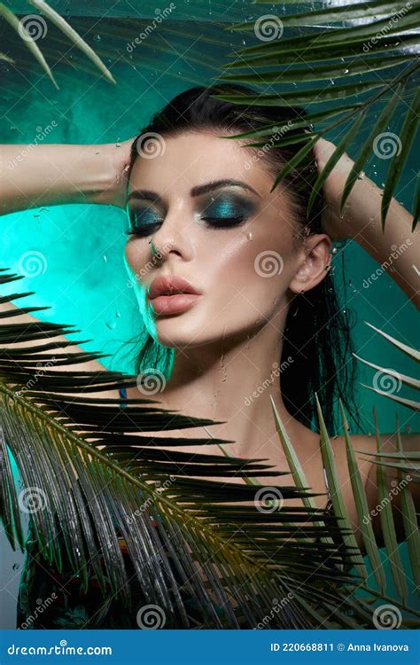 Tropical Portrait Sexy Woman In Leaves Palm Tree Bright Green Makeup Shadow Of Palm Leaves On