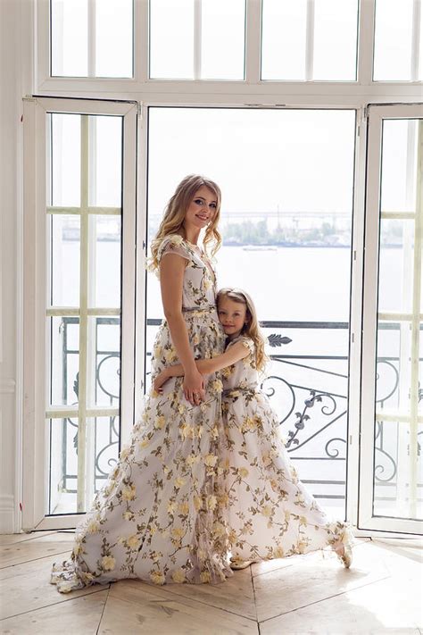 Mother And Daughter In Matching Dresses Standing Photograph By Elena
