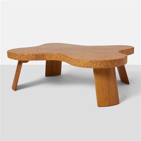 Several pieces of american black walnut are laminated together to form a beautiful table top with visible knots and color. Paul Frankl "Amoeba" Coffee Table at 1stdibs