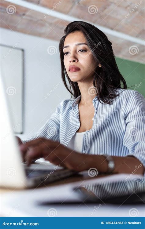 Elegant Young Business Woman Working With Her Laptop In The Office