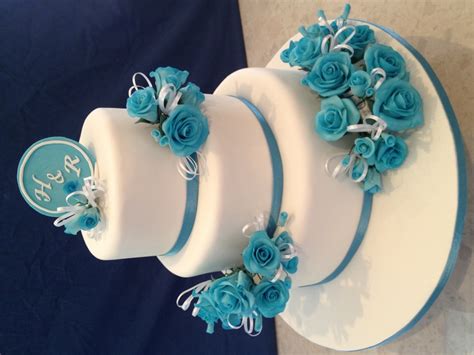 White Round Wedding Cake With Blue Flowers