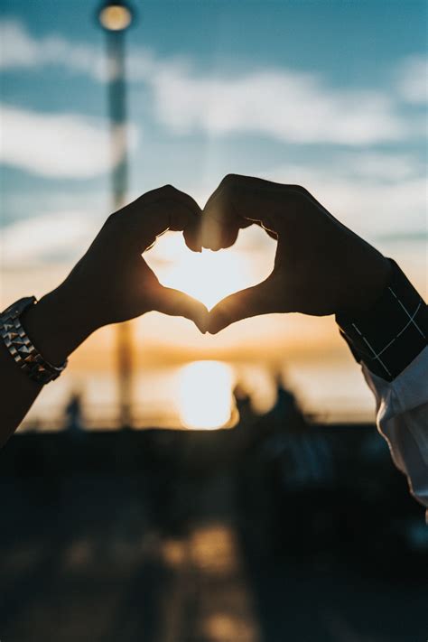 Person Forming Heart With Their Hands Photo Free Love Image On Unsplash