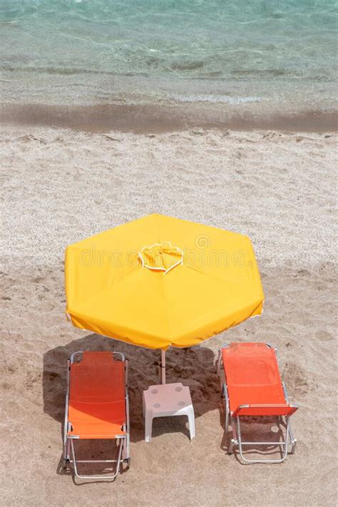 Two Chairs Under Umbrella On Tropical Beach Summer Vacation Concept