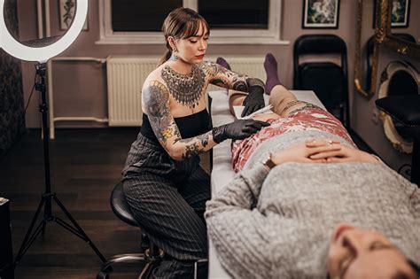 Tattoo Artist Cleaning A Tattoo Stock Photo Download Image Now