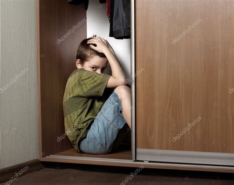 Sad Boy Hiding In The Closet Stock Photo By ©tatyanagl 5235715