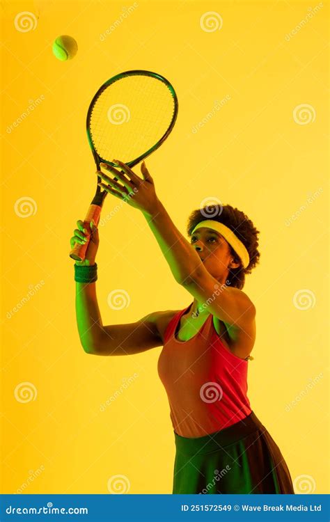 Vertical Image Of African American Female Tennis Player In Yellow