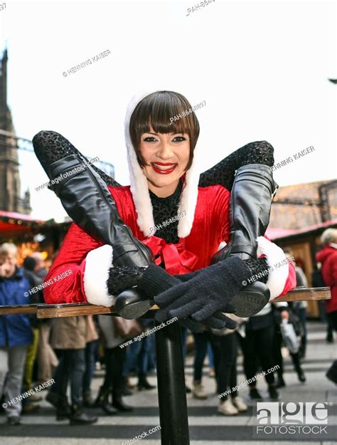 Contortionist Alina Ruppel Shows Off Her Skills On A Table At The Christmas Market In Cologne