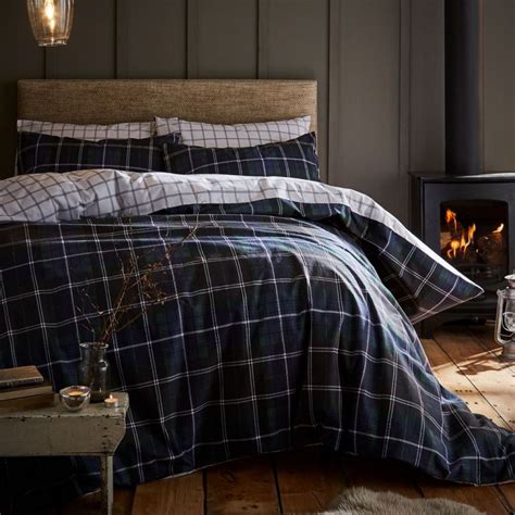 A duvet cover is a protective layer that slips over the duvet and has a closure. Tartan Check | Navy | Reversible | Flannelette | Duvet ...