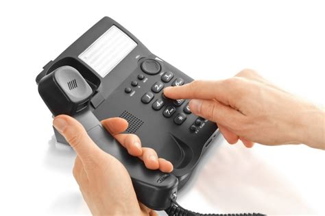 Premium Photo Mans Hand Dialing A Phone Number