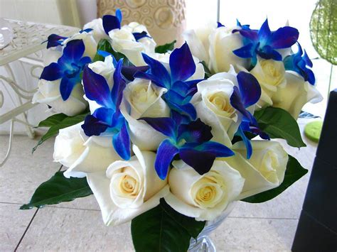 For instance, some bouquets can be arranged in big. Heart Shaped Wedding Bouquet Featuring: Ivory Roses, Blue ...
