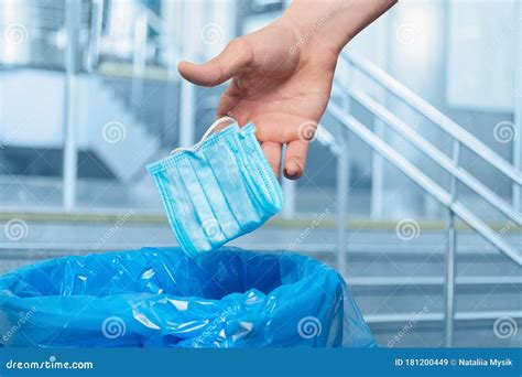 Hand To Throw A Protective Mask In The Trash Stock Image Image Of
